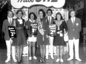 A.J Marriot Butlins Redcoat posing with winners of "Miss She"